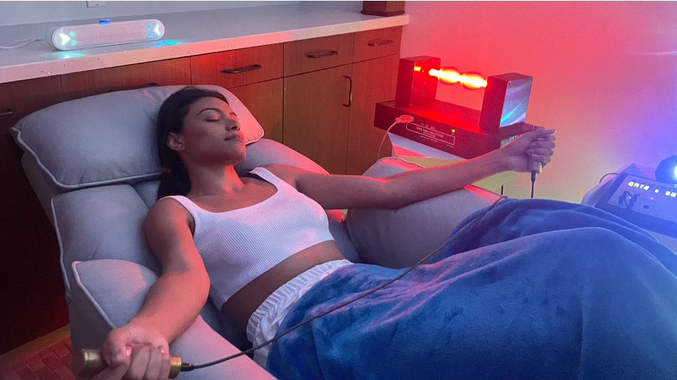 Client receiving a frequency and light therapy session