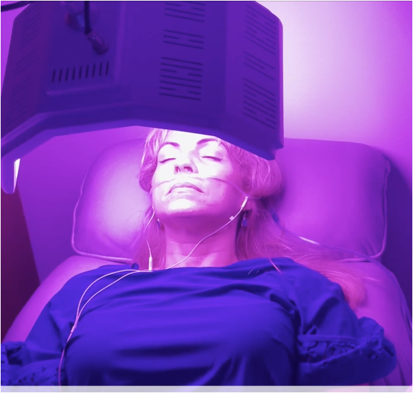 Client receiving violet chromotherapy light therapy